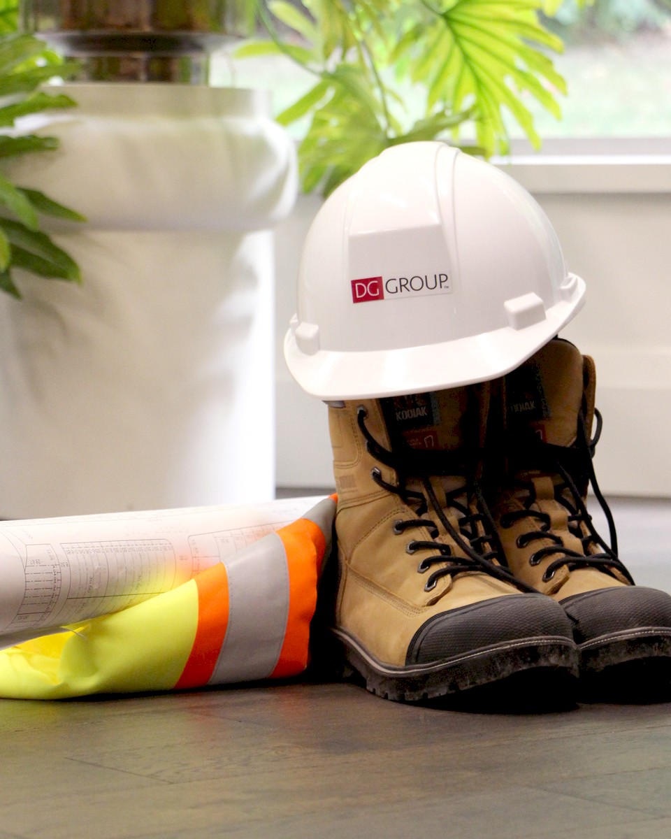 Hard boots, safety vest and hard hat.