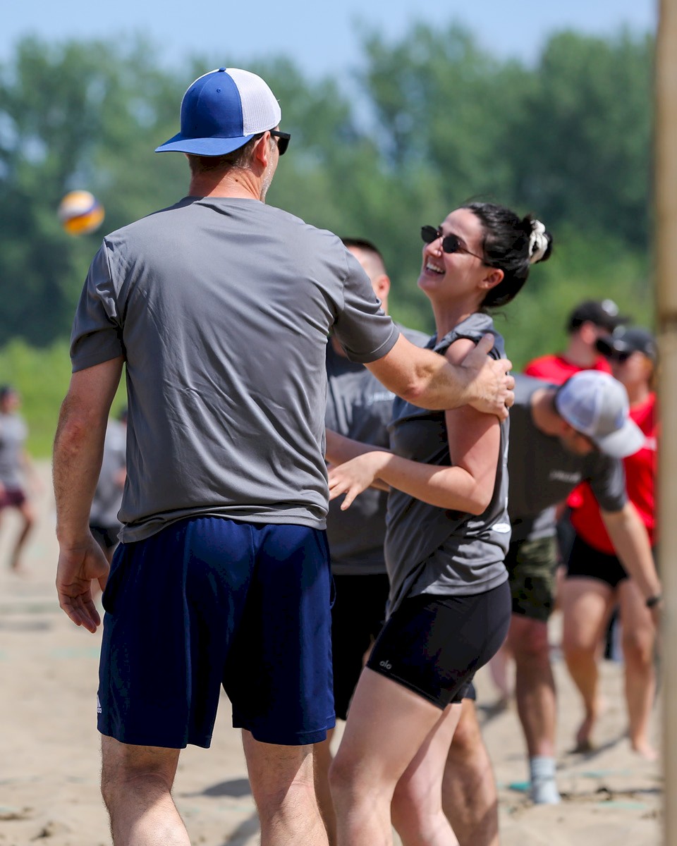 DG Group staff enjoying a volleyball game for a charitable cause.