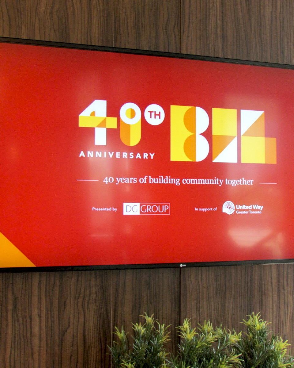 DG Group Building Industry Luncheon sponsorship sign showcased on a big screen.